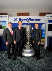 John Bukowicz (Left), 2014 Indianapolis 500 winner Ryan Hunter-Reay (Middle), and Vanessa Moriel (right).  Ryan Hunter-Reay was awarded the “BabyBorg” at the Automotive News World Congress for his achievements on the track.  The BorgWarner Championship Driver’s Trophy is awarded each year to the winner of the Indianapolis 500.