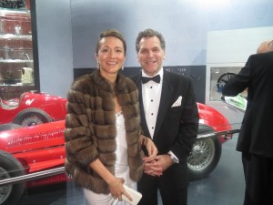 Vanessa Moriel and John Bukowicz pose in front of an Alfa Romeo on the evening of the Black Tie Gala. 