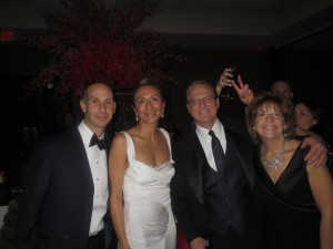 LEAR CTO Agis Liberakis, Vanessa Moriel, Lear CFO Jeffrey H. Vanneste, and his wife pose for a picture at the Lear After-Party. 