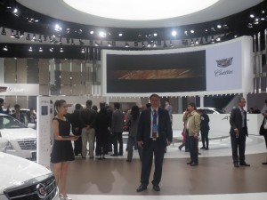 LIASE Group President and Managing Director Europe Wolfgang Doell standing in front of the Cadillac booth at the Shanghai Auto Show 2015. Cadillac unveiled a new Escalade as well as a hybrid version of its CT6 model.