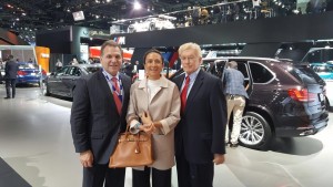 The LIASE Group’s John Bukowicz, Managing Director for the Americas (left), Vanessa Moriel, Managing Director Asia (right) and Vic H. Doolan, Non-Executive Member of the Board, take a picture at the LA Auto Show.  