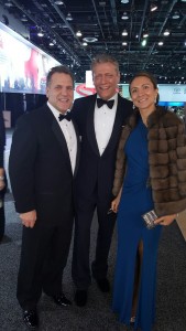 John Bukowicz, Managing Director for the Americas, LIASE Group (left); a TV presenter (center) and Vanessa Moriel, Managing Director Asia, LIASE Group pose during the black tie gala at the Detroit Auto Show. 