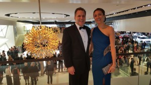 John Bukowicz, and Vanessa Moriel take a picture above the crowd during the black tie gala. 