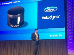 Ford CEO Mark Fields talking about the new Velodyne Puck sensor during his press conference in Las Vegas. Velodyne Lidar devices help autonomous cars scan the road ahead and plot a safe course.