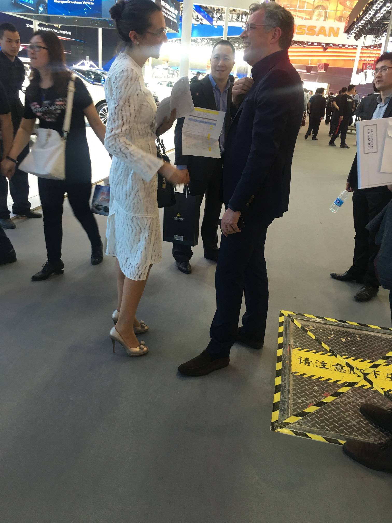Vanessa Moriel exchanges a few words with a Volvo Global Executive during the press day at the Beijing Auto Show. 