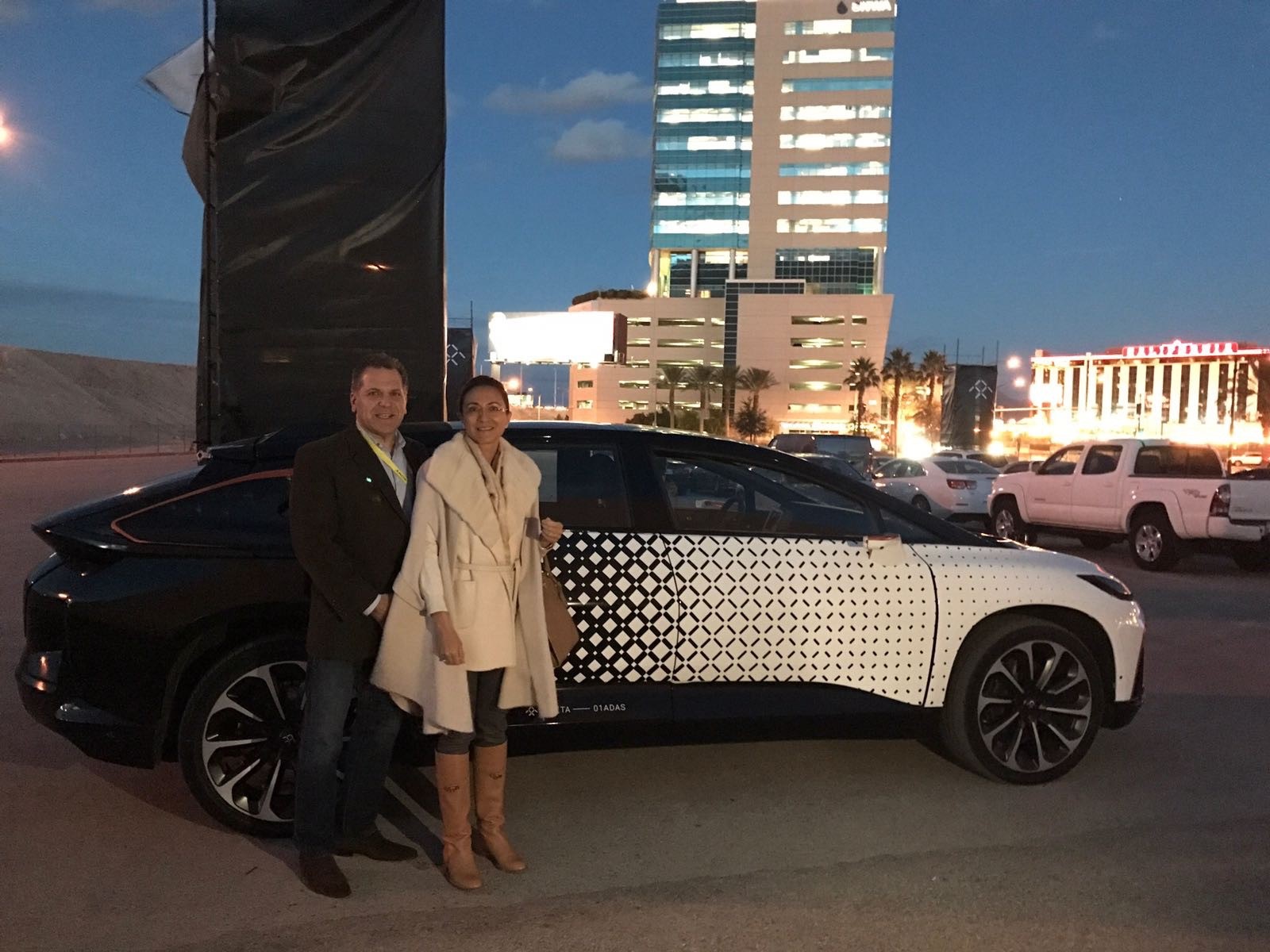 John Bukowicz, LIASE Group Managing Director Americas (left) and Vanessa Moriel, LIASE Group Managing Director Asia (right) pose in front of the FF91 reveal outside of CES 2017 in Las Vegas. 