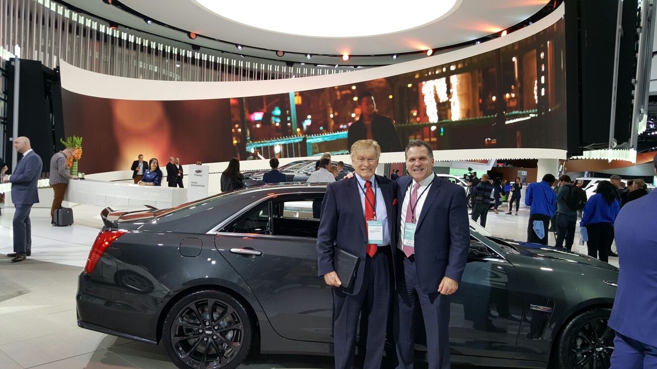 John Bukowicz and Vic Doolan stop to take a picture during the Detroit Auto Show. 