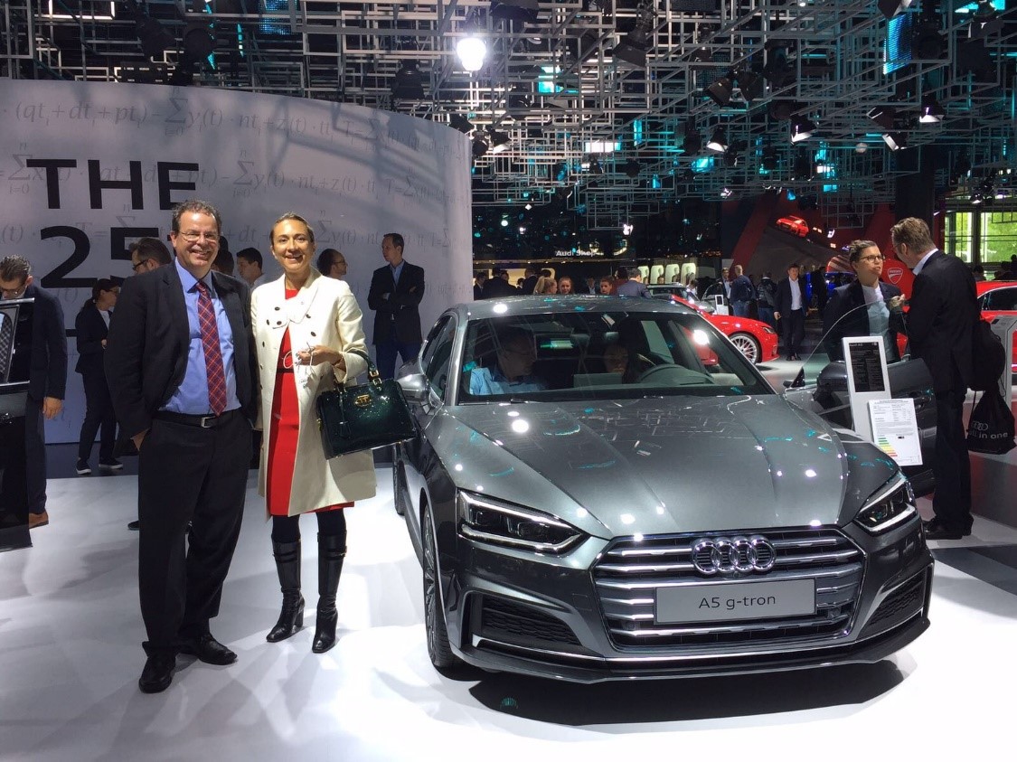 Vanessa and Wolfgang next to the Audi A5 g-tron, which can run on a choice of climate-friendly Audi e-gas, natural gas (CNG) or gasoline.