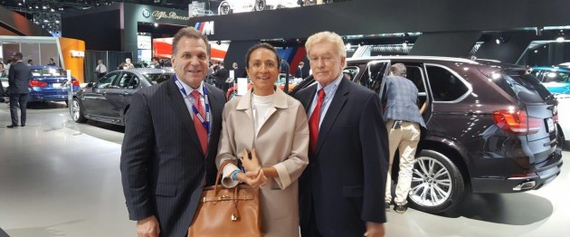 The LIASE Group’s John Bukowicz, Managing Director for the Americas (left), Vanessa Moriel, Managing Director Asia (right) and Vic H. Doolan, Non-Executive Member of the Board, take a picture at the LA Auto Show.